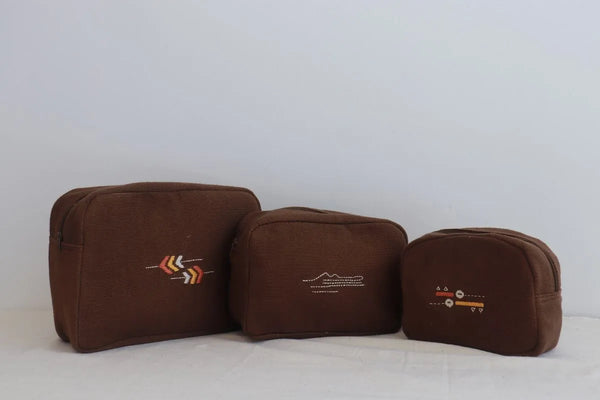 Brown cotton toiletry bag with a wide zip closure, handmade in India for travel