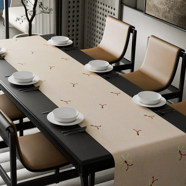 Butterfly-patterned table runner laid down the centre of a dining table