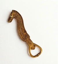 Brass Dokra horse bottle opener with ropework lines, handle shaped as a horse