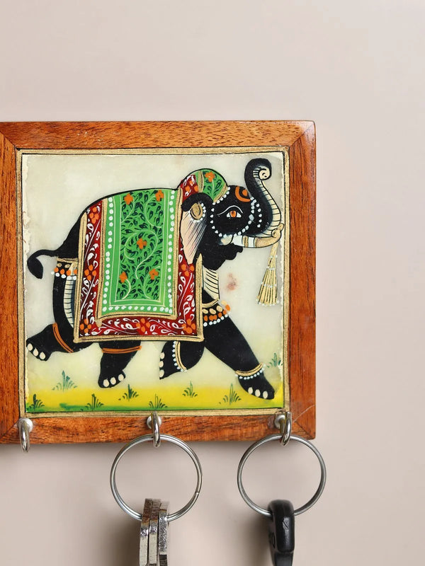 Small handpainted marble wall hanging with earthy glazed finish, front view