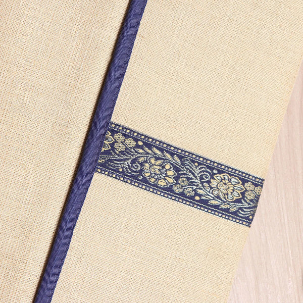 Envelope-style jute file folder in natural golden-brown woven fabric, front view