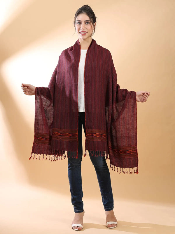 Maroon Himachali shawl flat-laid, showing the deep wine body and the geometric Kinnauri border at each end.