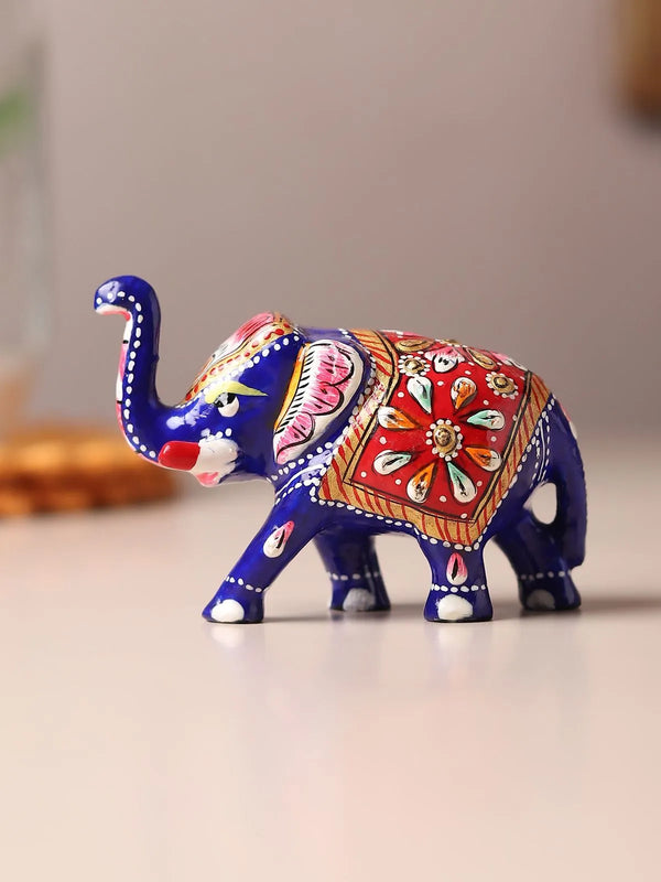 Handcrafted meenakari elephant showpiece in red, green and gold enamel carrying an ambabari royal seat