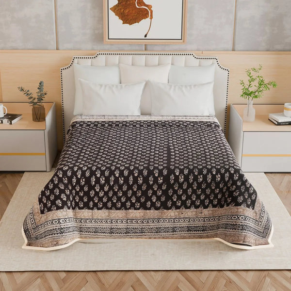 Midnight buta hand block-printed cotton bed cover with paisley motifs in a repeating grid