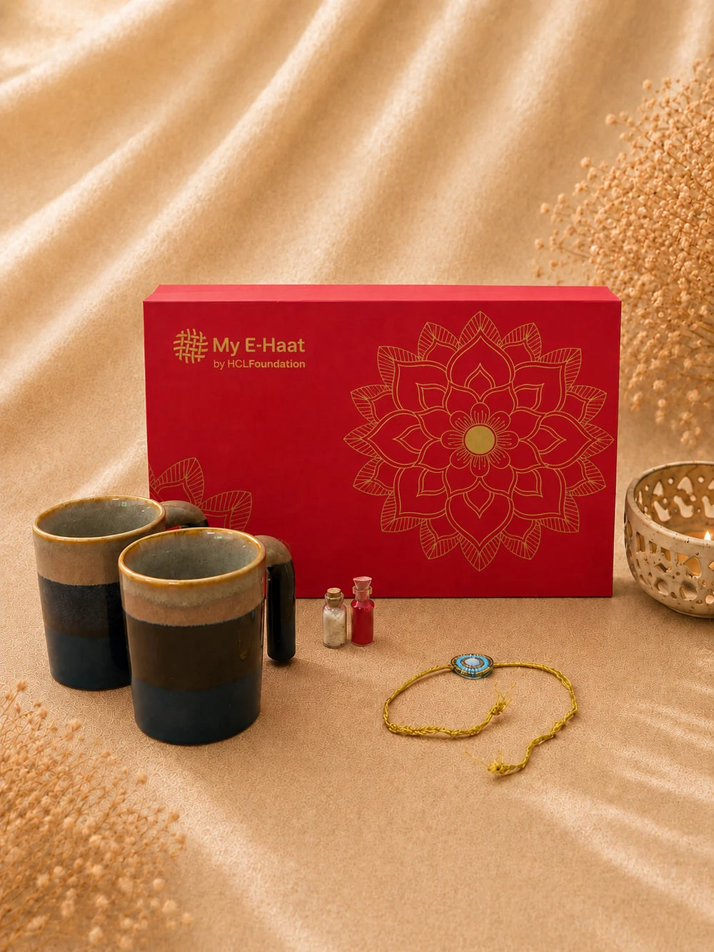 Rakhi Hamper for Him featured image with branded red gift box, two handcrafted ceramic mugs and rakhi - My E-Haat by HCL Foundation