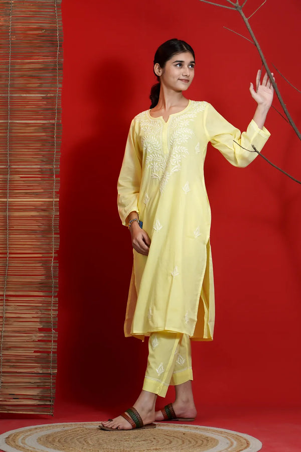 Yellow Chikankari A-line kurta and pant set with white hand-embroidered floral threadwork