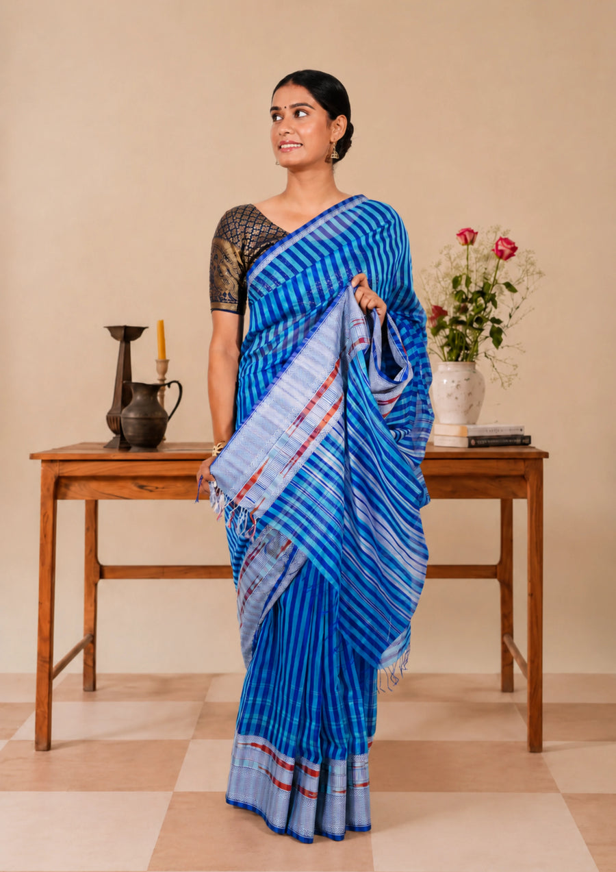 Azure blue striped Maheshwari saree with a silver-toned border, full drape view
