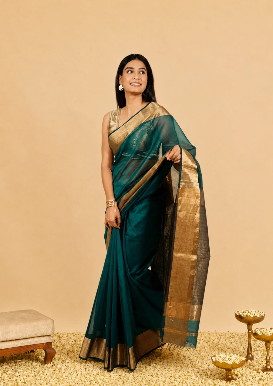 Bottle green Maheshwari saree with a wide golden zari border and a contrast pallu