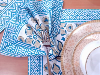 Blue and white color organic cotton place mats, table runner and napkins set,, hand block printed in India with vibrant floral design.